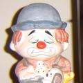 This little clown is actually a piggybank. I've had it since I was a kid and though it really doesn't go with the rest of my room (house!) it stays. It reminds me of home and being a kid. The link is my old primary school.