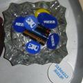 Coins of 013 and Mezz in an unused (I am a non smoker.. most of the time) ash tray. Mezz is our local concert venue. Every now and then they have cool bands. There could be more. 013 is THE stage in the south of the Netherlands. The white box on the bottom of the picture holds ear plugs. How fitting...