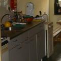 It isn't really 'in' my room, but I can still see the kitchen from the room, so I will include this one. My kitchen is pretty big and even fits a picknick table. Come try out my cooking sometime... 