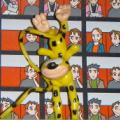 Ha, Marsupilami! This is one of my 4 Marsupilamis. My sister got me two, but I don't really remember where the other two came from. In the background is a card with a comic by Floor de Goede. He's really good, really funny and really gay too.